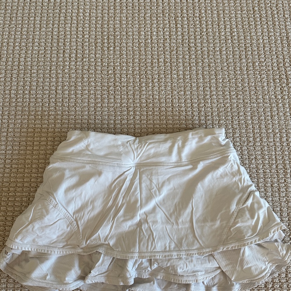 Rare white lululemon skirt with ruffles down the back, in size 4